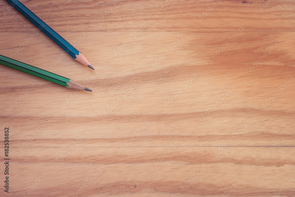 Business Creative and Idea Concept : Top view of two pencil put on wooden foor. (Selective focus) Business Creative and Idea Concept : Top view of two pencil put on wooden foor. (Selective focus)