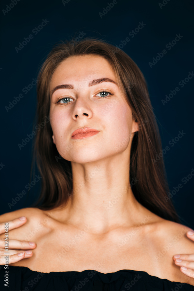 Portrait beautiful girl on a dark studio background Portrait beautiful girl on a dark studio background