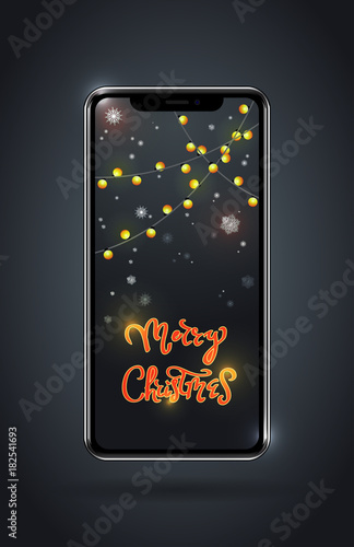 Modern technologies and holidays. A smartphone with a festive decor on the screen. Congratulations and shopping online. Close-up.