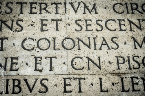 Latin inscription on the outside wall of Ara Pacis wall in Rome, Italy photo
