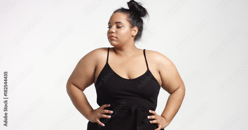 Plus size model in studio shoot happy smiling Plus size model in studio shoot happy smiling