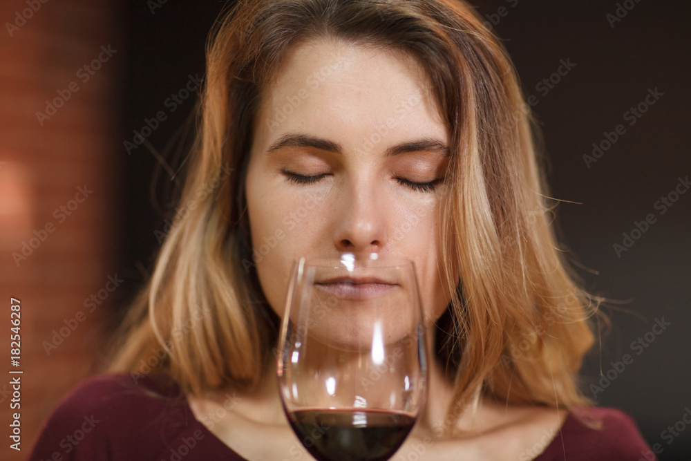 Attractive woman taste red wine in the restaurant Attractive woman taste red wine in the restaurant