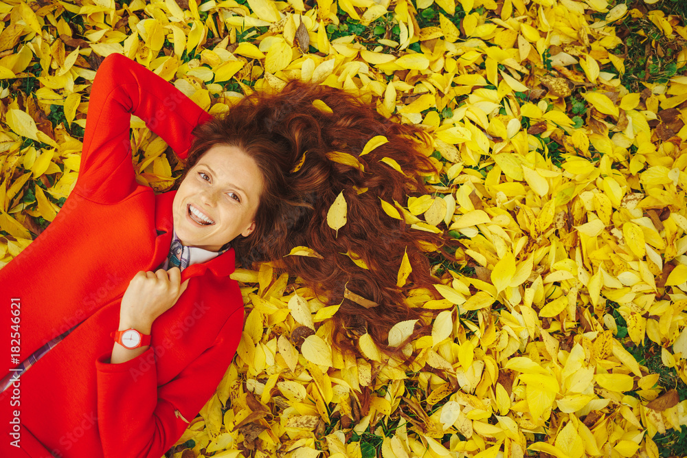 Young beautiful lady surrounded autumn leaves Young beautiful lady surrounded autumn leaves