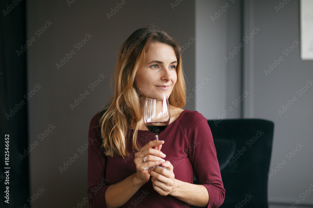 Attractive woman drink red wine in the restaurant Attractive woman drink red wine in the restaurant