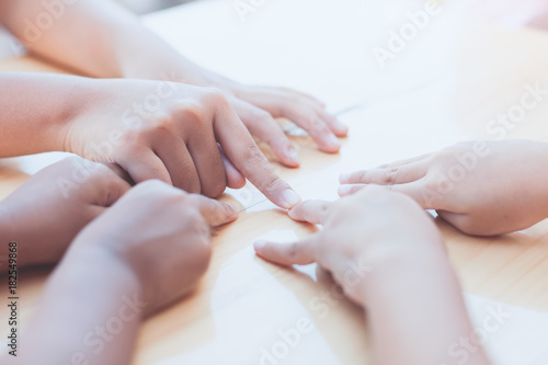 Children little kids playing circle point finger game with fun together