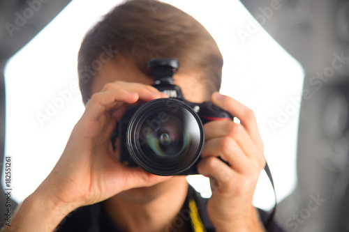 Man photographer journalist reporter operator selfie in mirror. Camera photo shot.