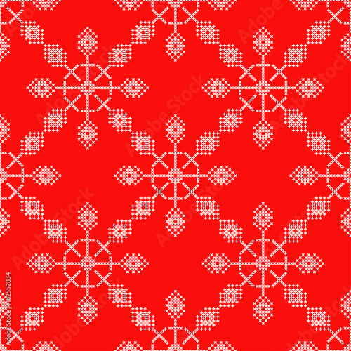 Seamless vector background cross stitch Norwegian snowflakes. Folk motifs. Winter pattern. Textile rapport.