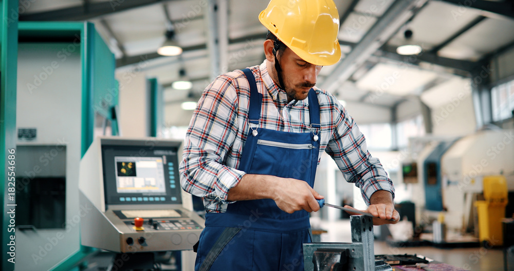 modern industrial machine operator working in factory modern industrial machine operator working in factory