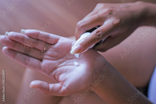 Hands testing texture of beauty products applying skin-care or moisturizer