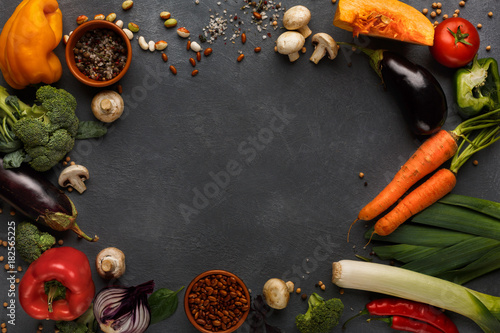 Frame of fresh vegetables on wooden background with copy space