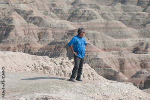 Middle Aged Man Looking At The Rocks At The Badlands National Park In South Dakota