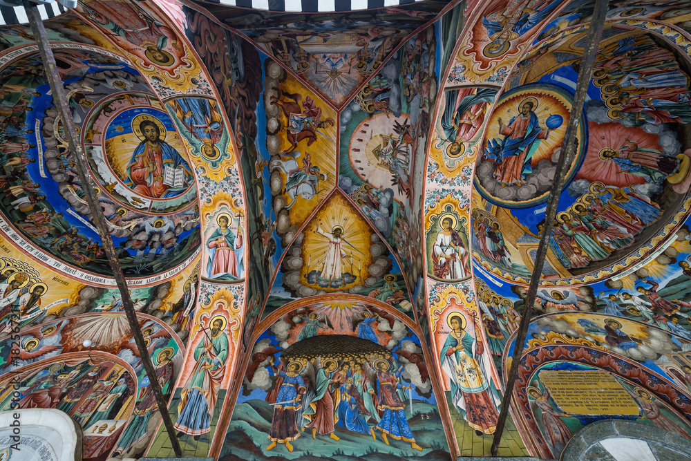 Vibrant religious painting on the ceiling of outer corridor of RIla Monastery, Bulgaria
