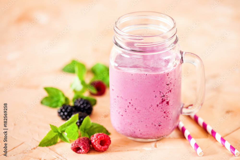 Delicious blackberry raspberry smoothie with mint and fresh berries in glasses. Selective focus. Delicious blackberry raspberry smoothie with mint and fresh berries in glasses. Selective focus.