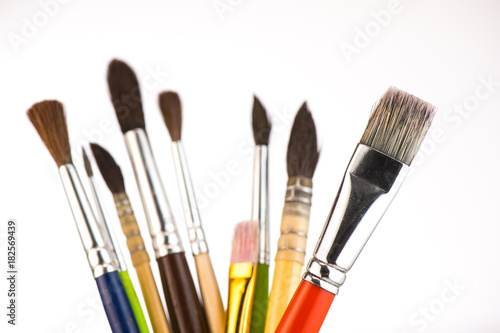 Paint brushes in a jar on whith background