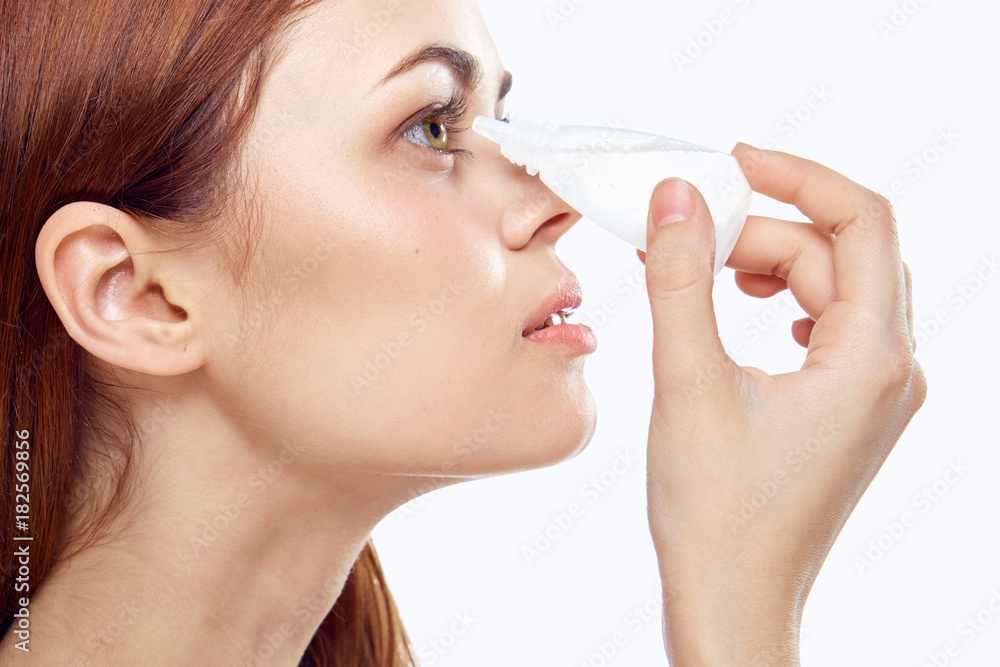 the girl digs a drop into her eyes the girl digs a drop into her eyes