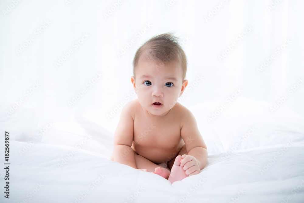 baby laying wearing diaper