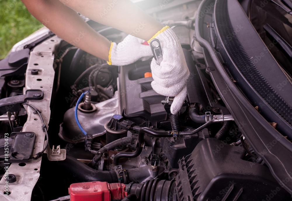 Fototapeta premium Auto mechanic checking engine,Maintenance car repair automotive in car