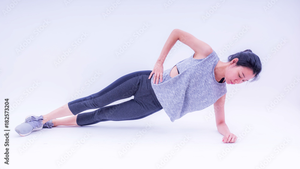 Fitness woman doing fitness plank position exercises. Photo of woman in silhouette on white background. Fitness and healthy lifestyle concept