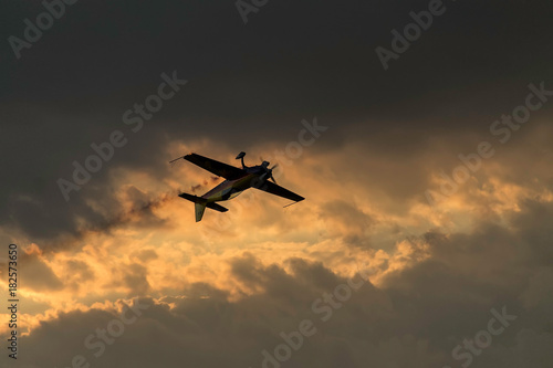 Airplane on a sunset sky at an air show