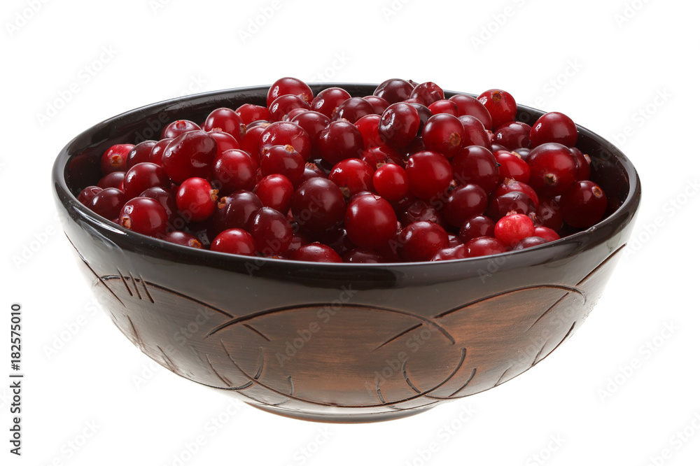 cranberries in a clay bowl isolated on white background cranberries in a clay bowl isolated on white background