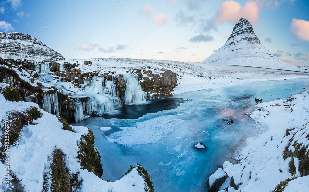 Fototapeta premium Kirkjufell waterfall with mountain in winter, Iceland
