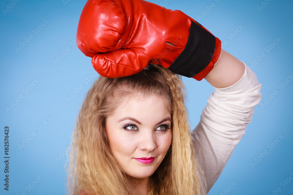 Cute girl in red gloves playing sports boxing Cute girl in red gloves playing sports boxing