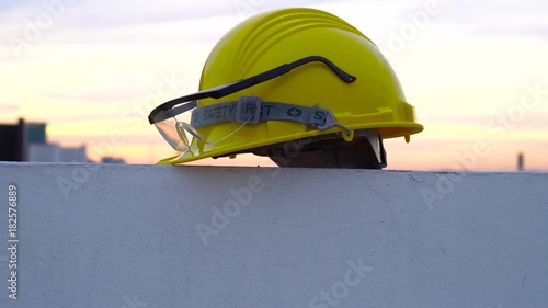 Panning shot of Construction helmet at sunset