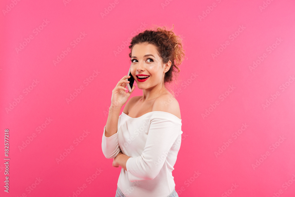 Portrait of an excited smiling girl talking on mobile phone Portrait of an excited smiling girl talking on mobile phone