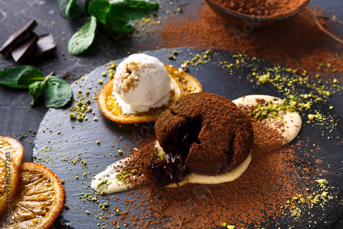 Chocolate fondant with creme anglaise and vanilla ice cream photo