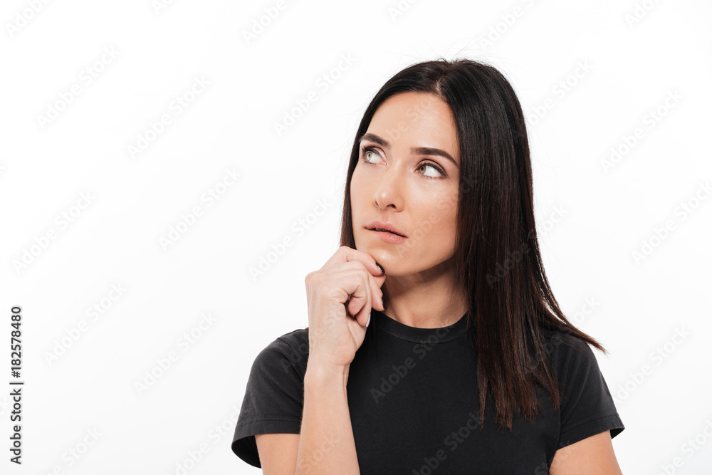 Portrait of a young thoughtful woman looking away Portrait of a young thoughtful woman looking away