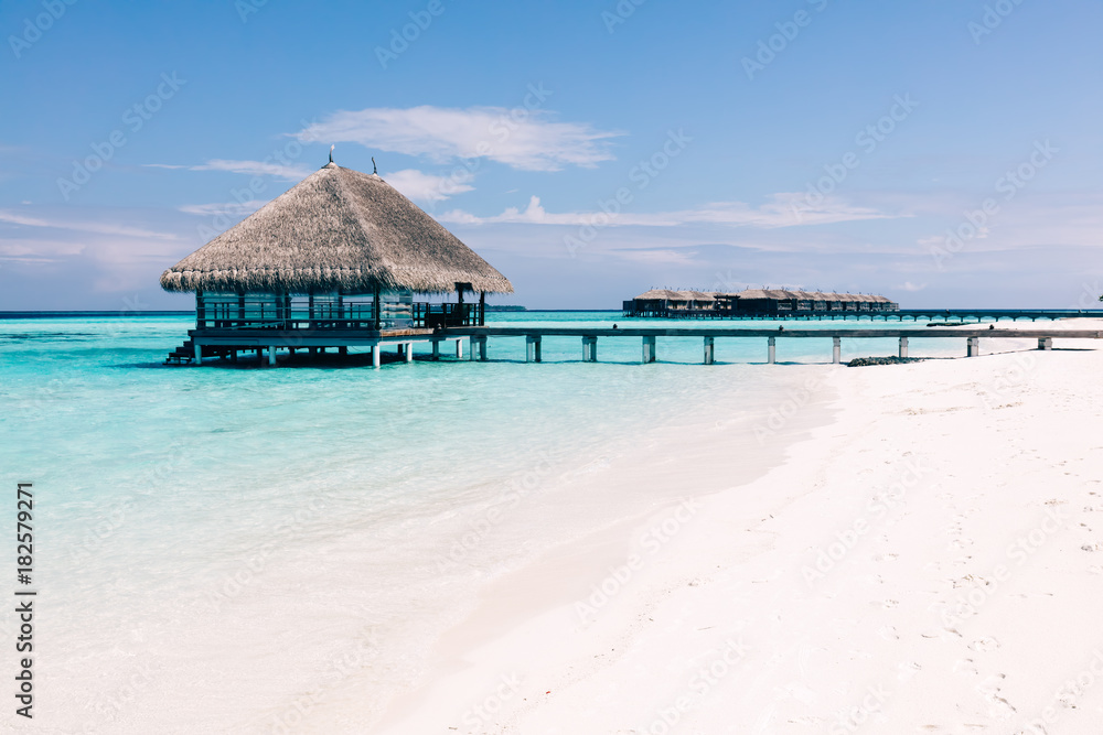 Wooden terrace on stakes and jetty on tropical island