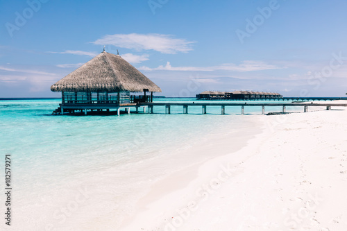 Wooden terrace on stakes and jetty on tropical island