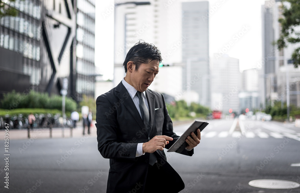 Senior business man moments on the streets of Tokyo Senior business man moments on the streets of Tokyo