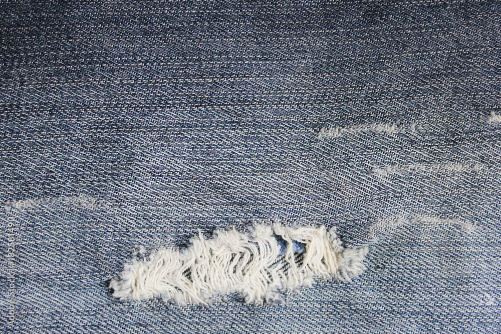 Jeans torn top at bottom
