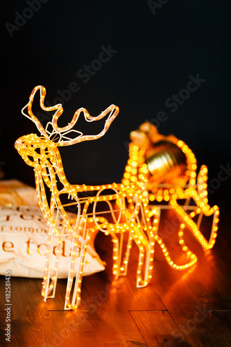 New Year glowing reindeer with sleigh