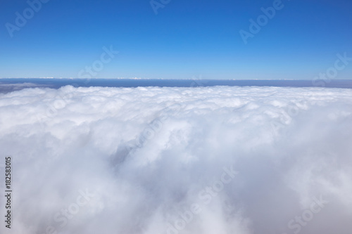 A beautiful landscape high in the mountains with clouds in the afternoon.