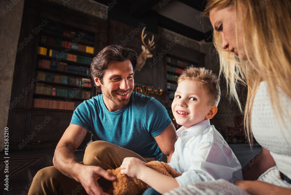 Family home portrait. Parents and son spending time together