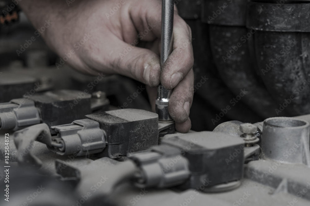 Car engine repair. Replacing the spark plugs in the engine. Repair of the old machine. Car engine repair. Replacing the spark plugs in the engine. Repair of the old machine.
