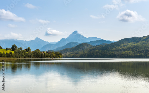 Green water Weissensee lake in Alps Mountains