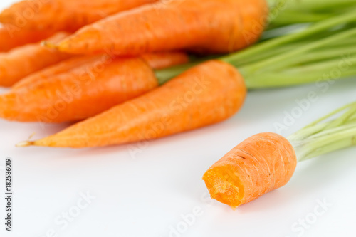 carrots with leaf on a white plate