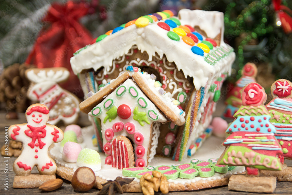 Gingerbread house. Christmas holiday sweets. European Christmas holiday traditions. Christmas gingerbread house and holiday decorations.