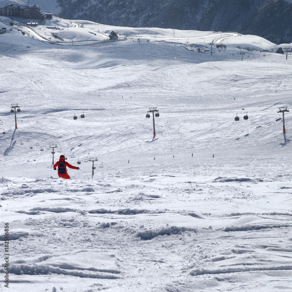 Snowboarder downhill on freeride trace Snowboarder downhill on freeride trace