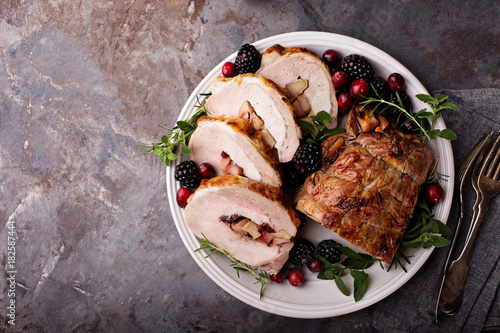 Photos Roasted pork loin stuffed with apple and cranberry