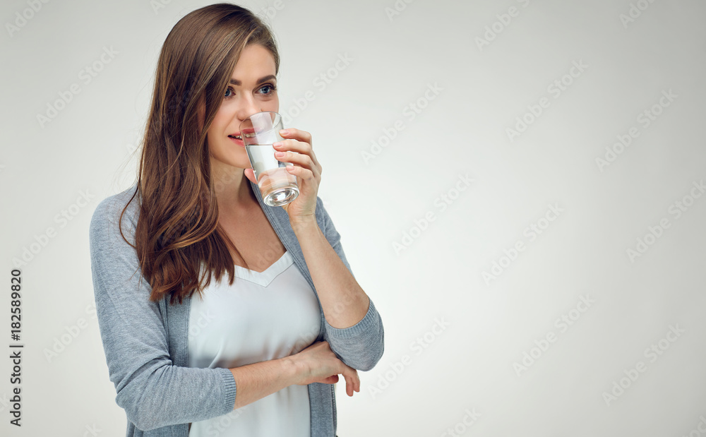 Portrait of smiling woman with long hair holding water glass. Portrait of smiling woman with long hair holding water glass.