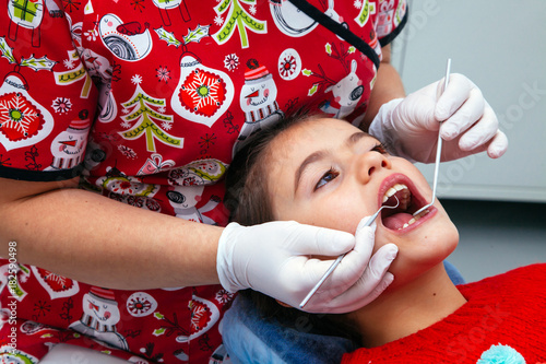 Treatment office children dentist teeth small girl teen red doctor new year discount woman clean clinic quietly comfortably