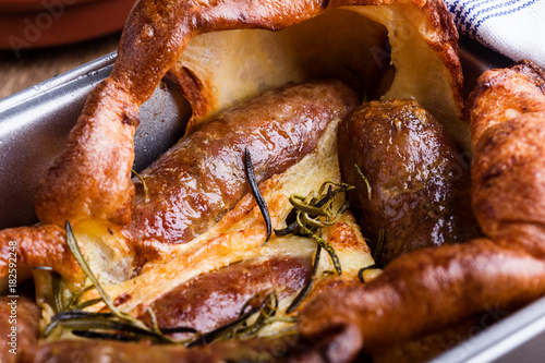 Sausages in Yorkshire pudding batter photo