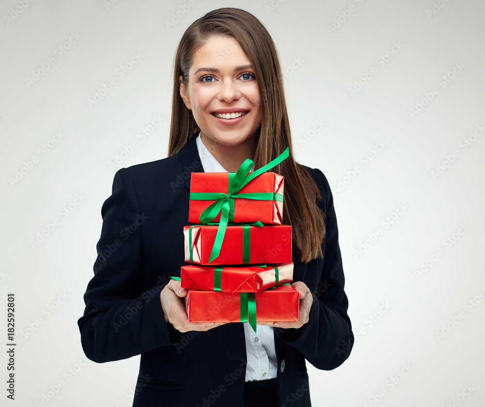 Smiling woman holding pile of small gift boxes. Smiling woman holding pile of small gift boxes.