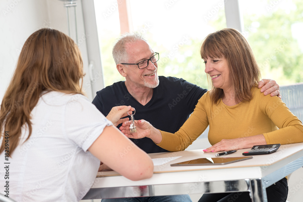 Senior couple meeting real estate agent Senior couple meeting real estate agent