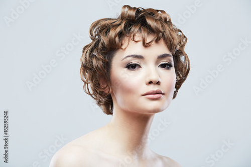 Young woman close up face beauty portrait on white background.