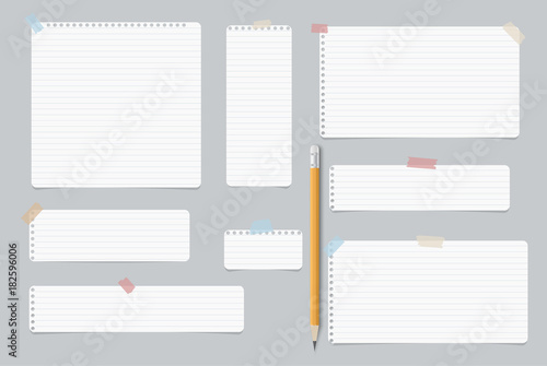 Blank lined, note, notebook, copybook paper sheets for text or message with pencil stuck tape on gray background.